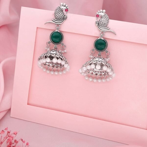 Silver Peacock Jhumka Earrings with Green & Red Stones